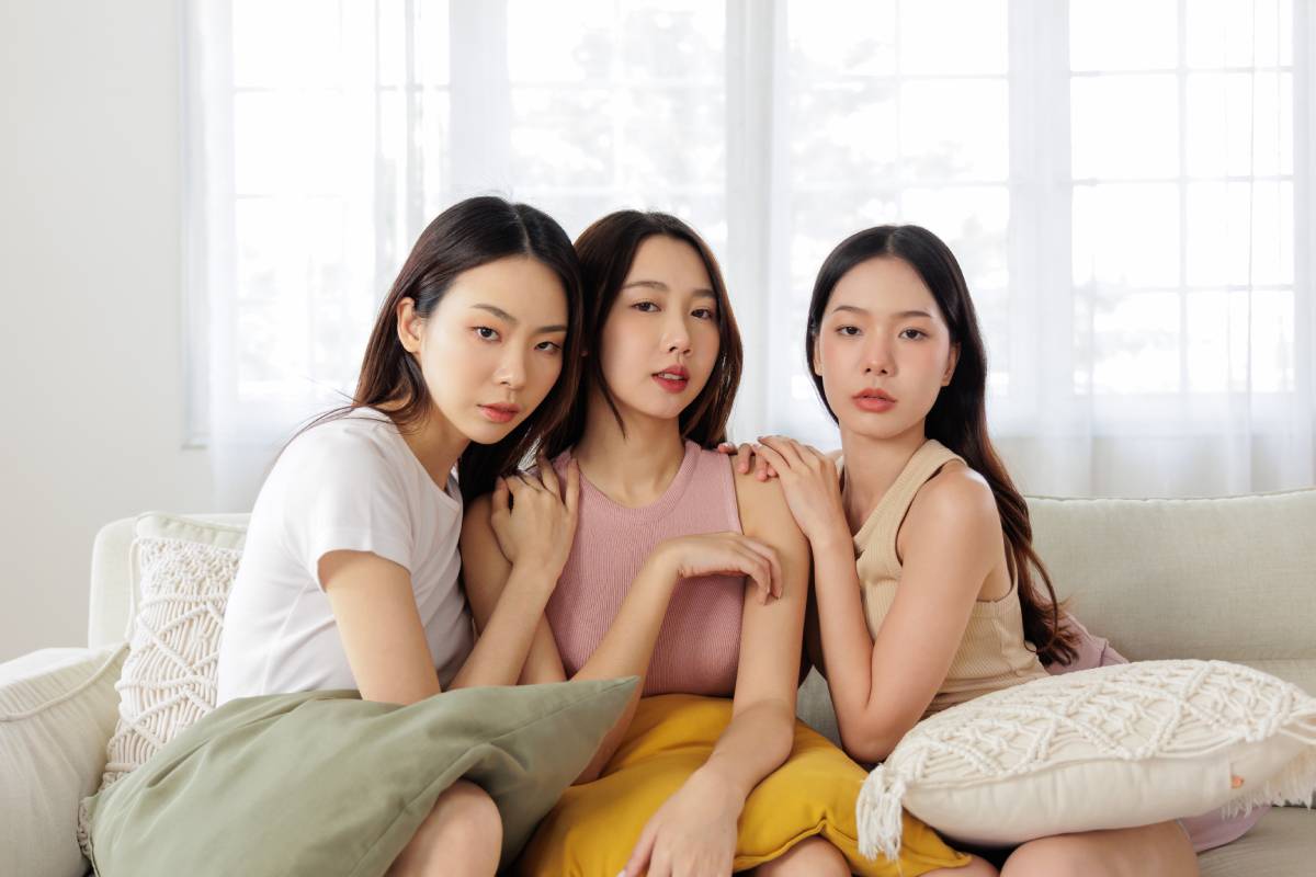 Seductive Asian models friendships posing confidently show flawless facial skin